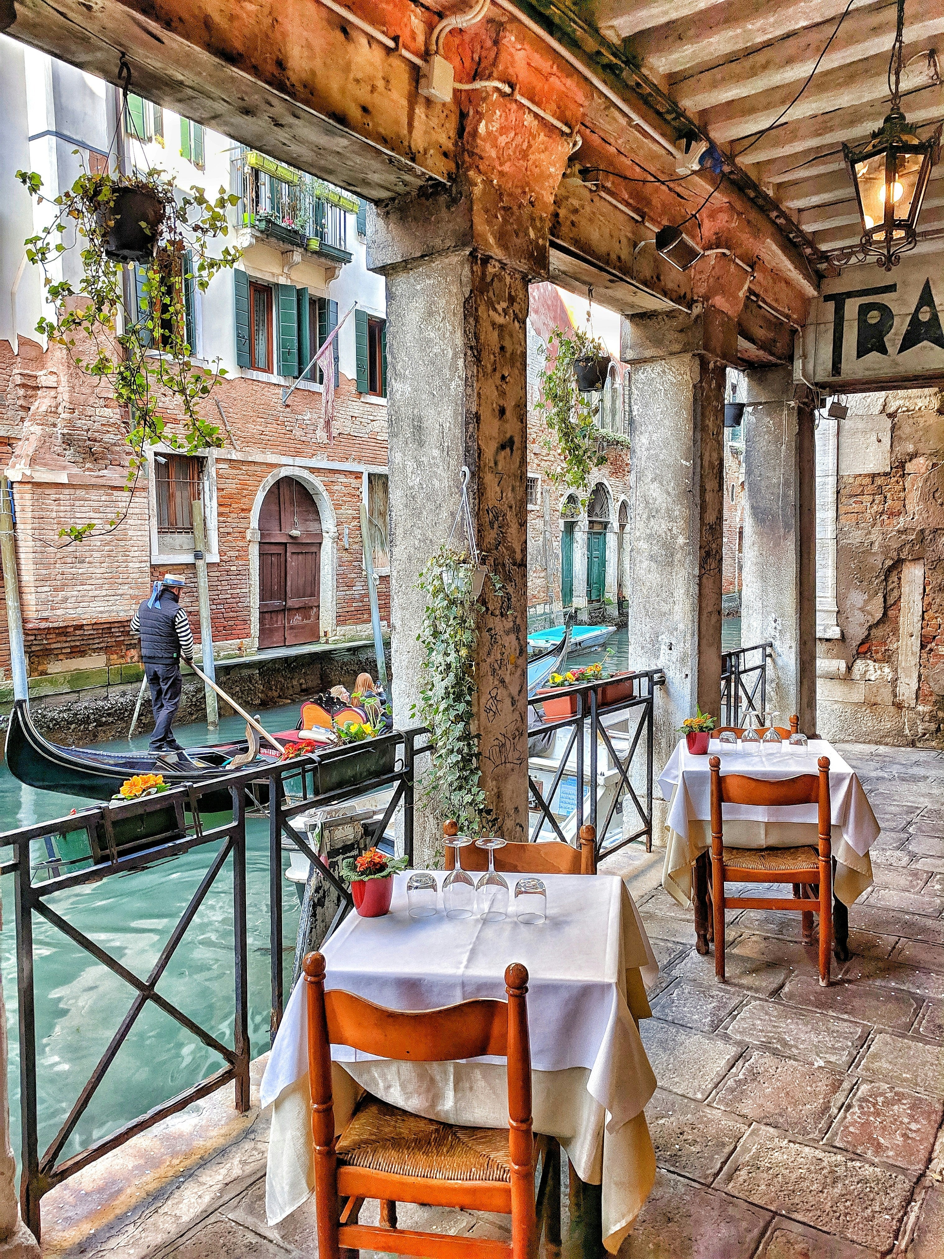 A canal-side restaurant table in Europe